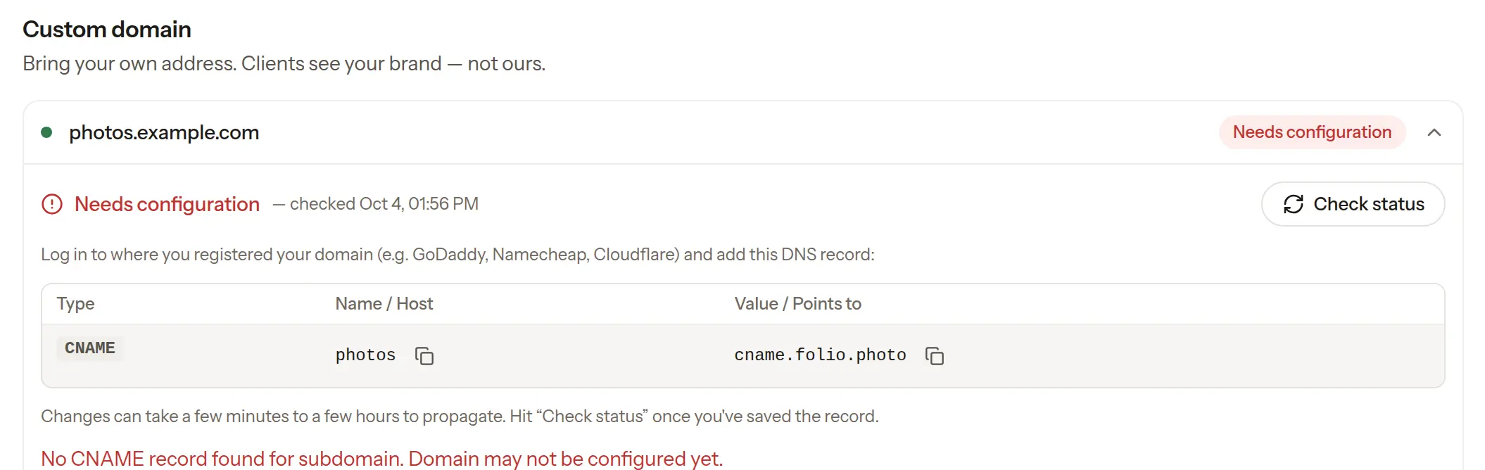 Folio's domain settings showing the DNS record to add for a custom domain